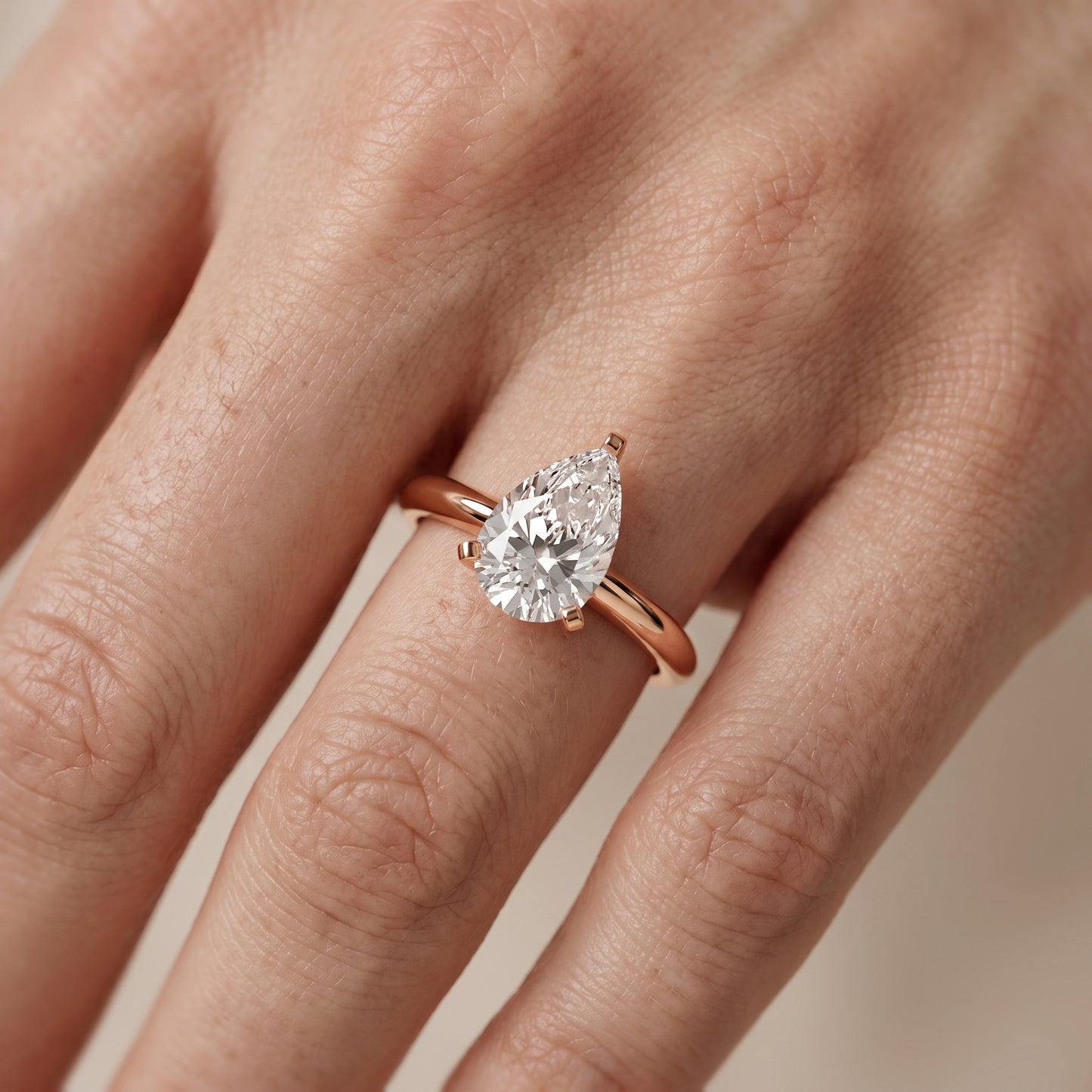 Amira Six-Prong Solitaire Pear Diamond Engagement Ring in Rose Gold - lifestyle.jpg