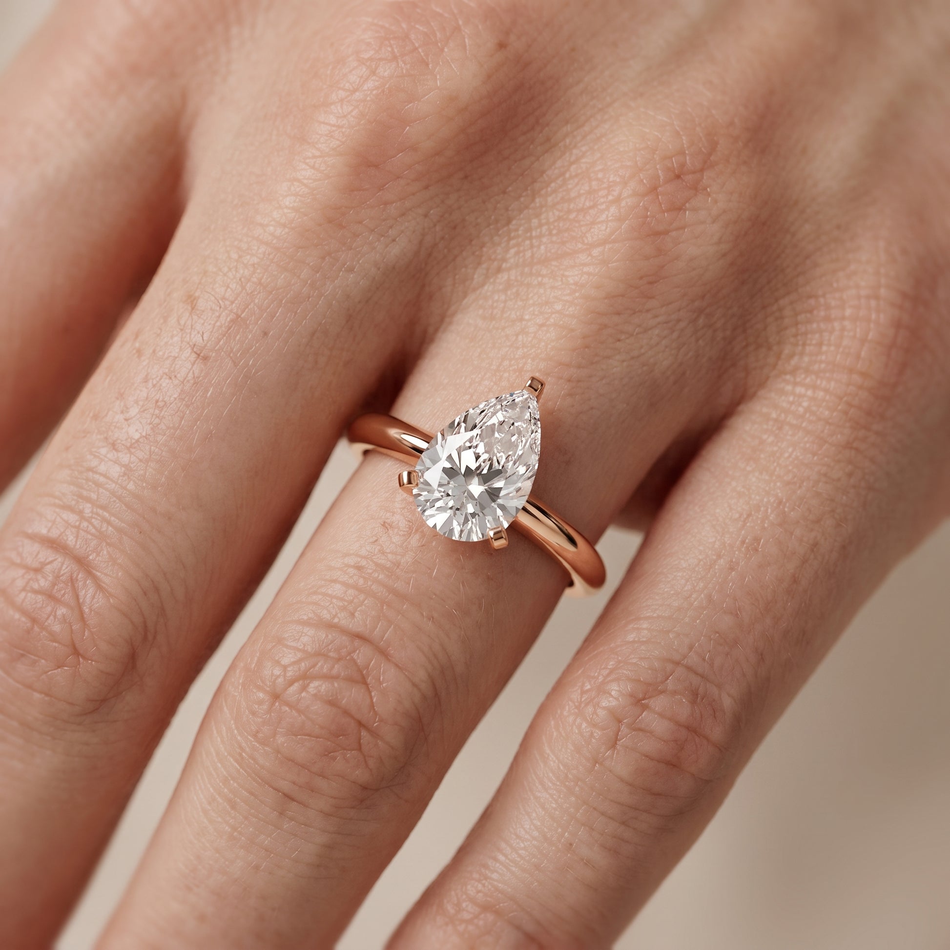 Amira Six-Prong Solitaire Pear Diamond Engagement Ring in Rose Gold - lifestyle.jpg