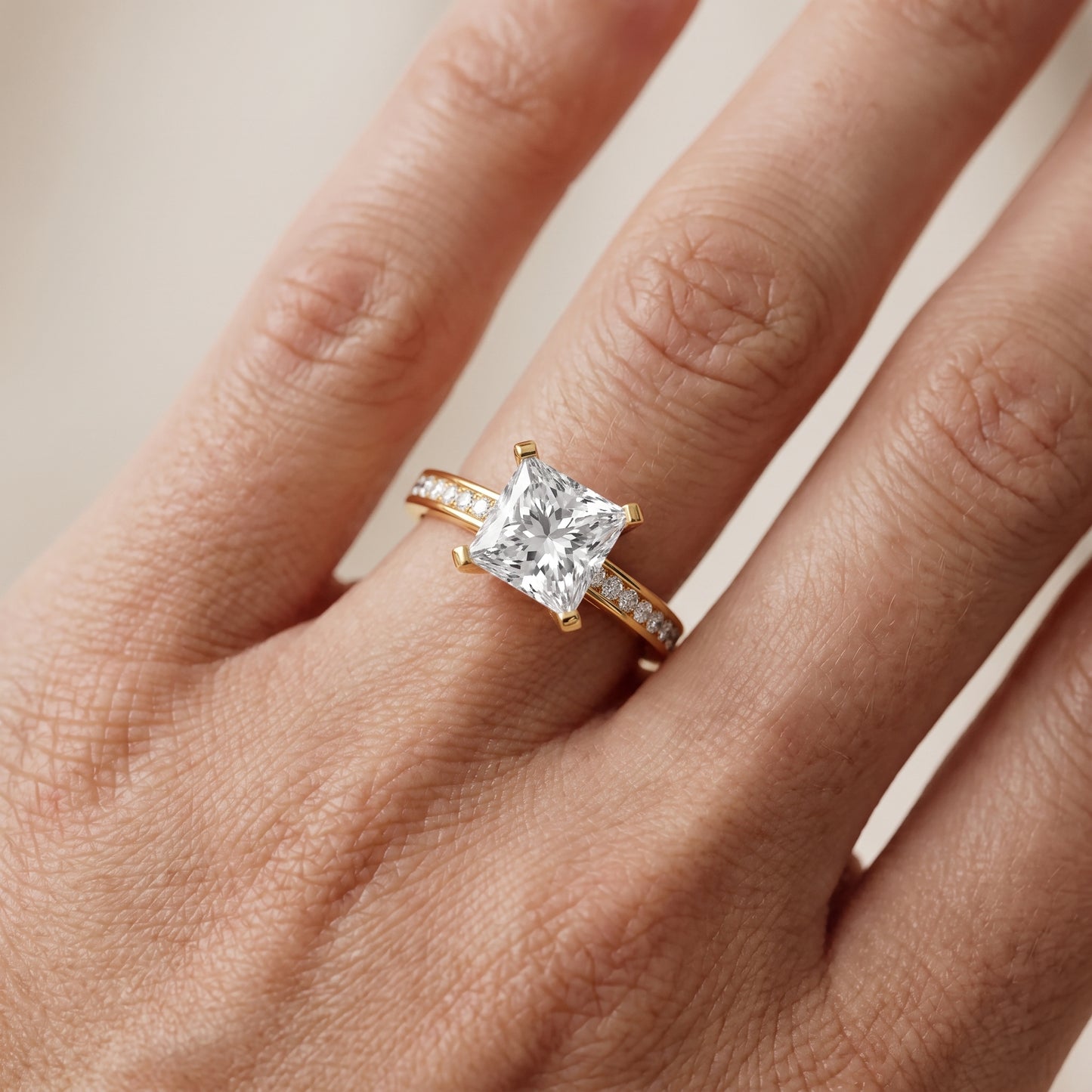 Tessa Solitaire Channel Set Princess Diamond Engagement Ring in Yellow Gold - lifestyle.jpg
