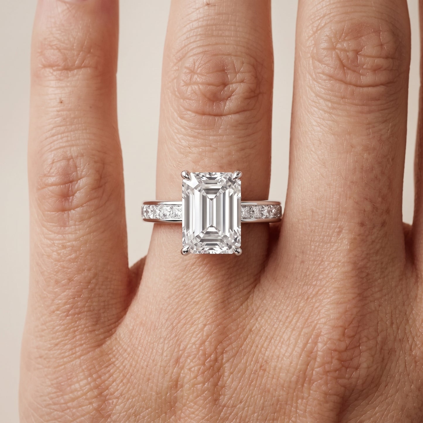 Brielle Channel Set Solitaire Emerald Diamond Ring in Platinum - lifestyle.jpg