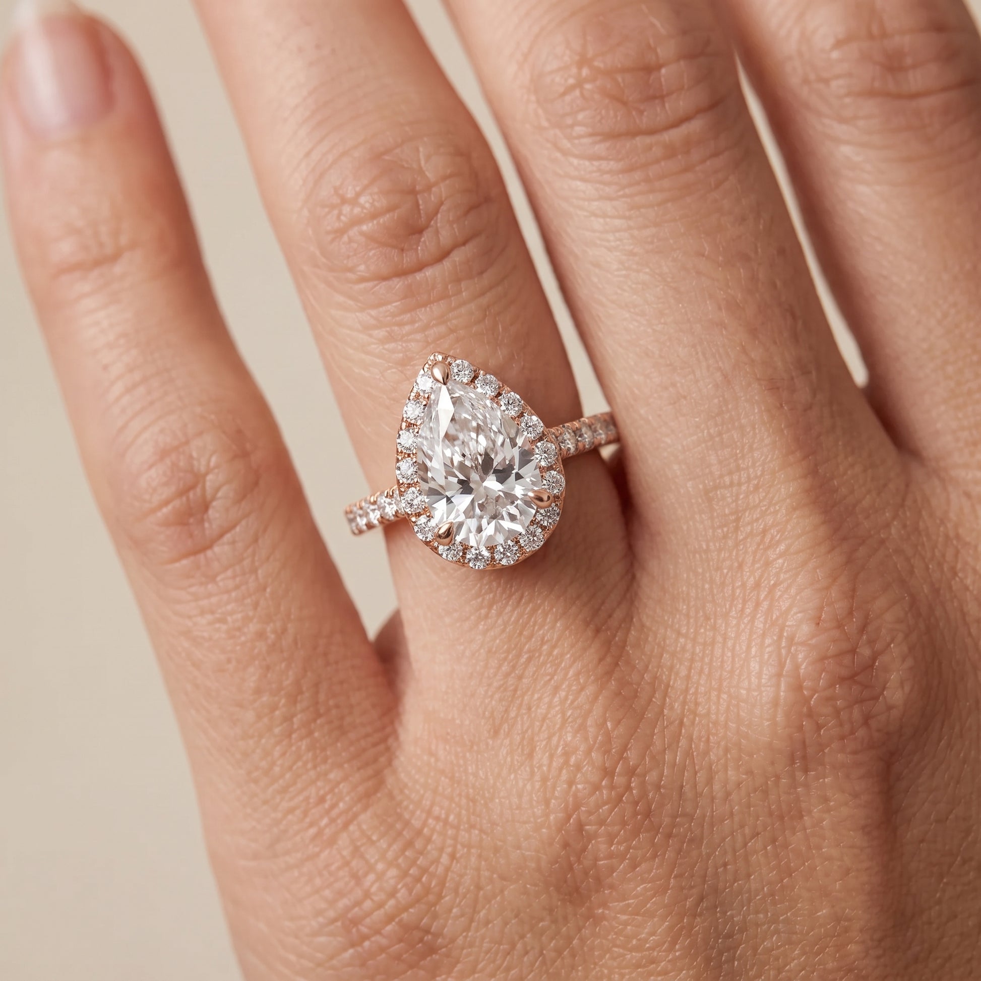 Amara Halo Claw Prong Pear Diamond Ring in Rose Gold - lifestyle.jpg