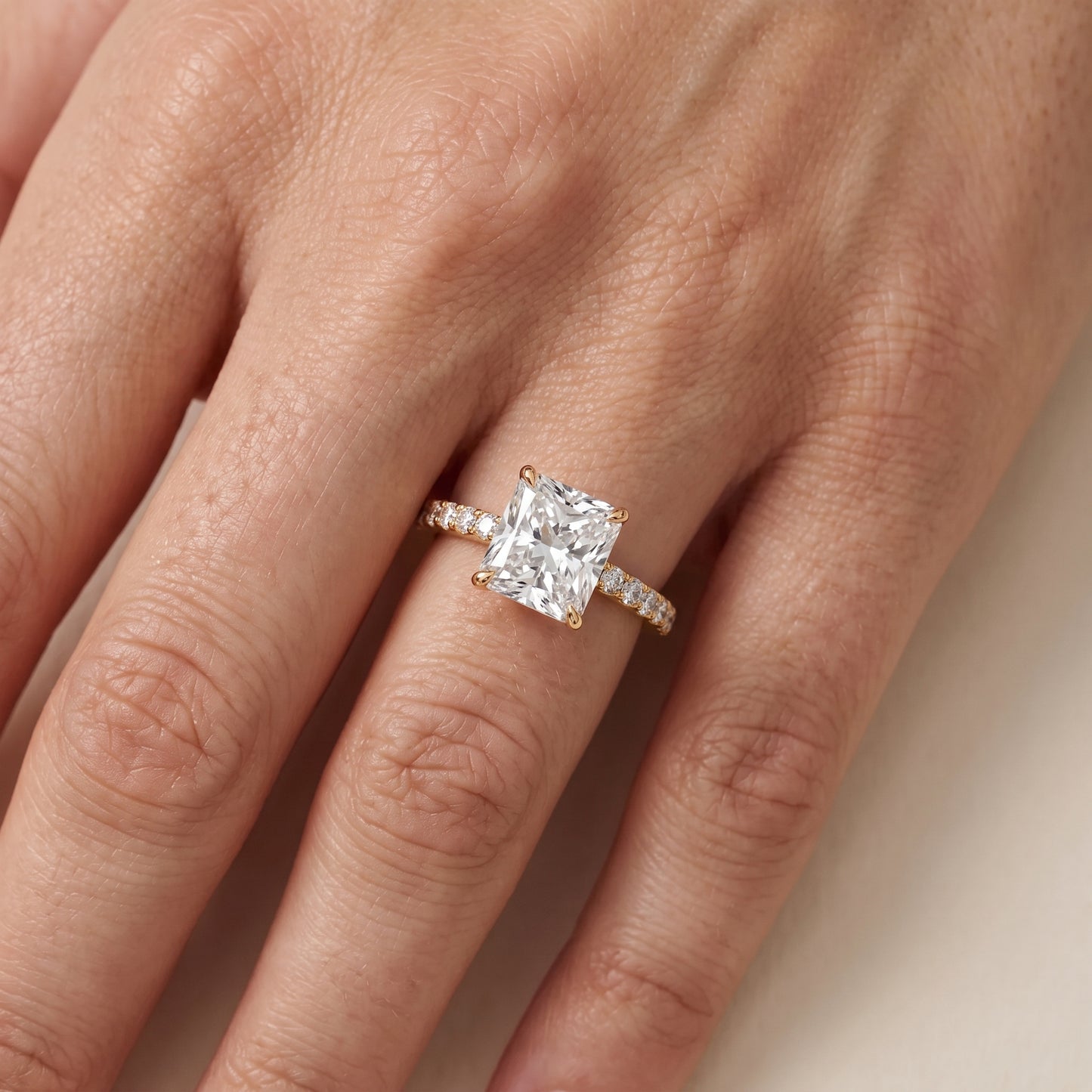 Aisha Pavé Solitaire Radiant Diamond Engagement Ring in Yellow Gold - lifestyle.jpg