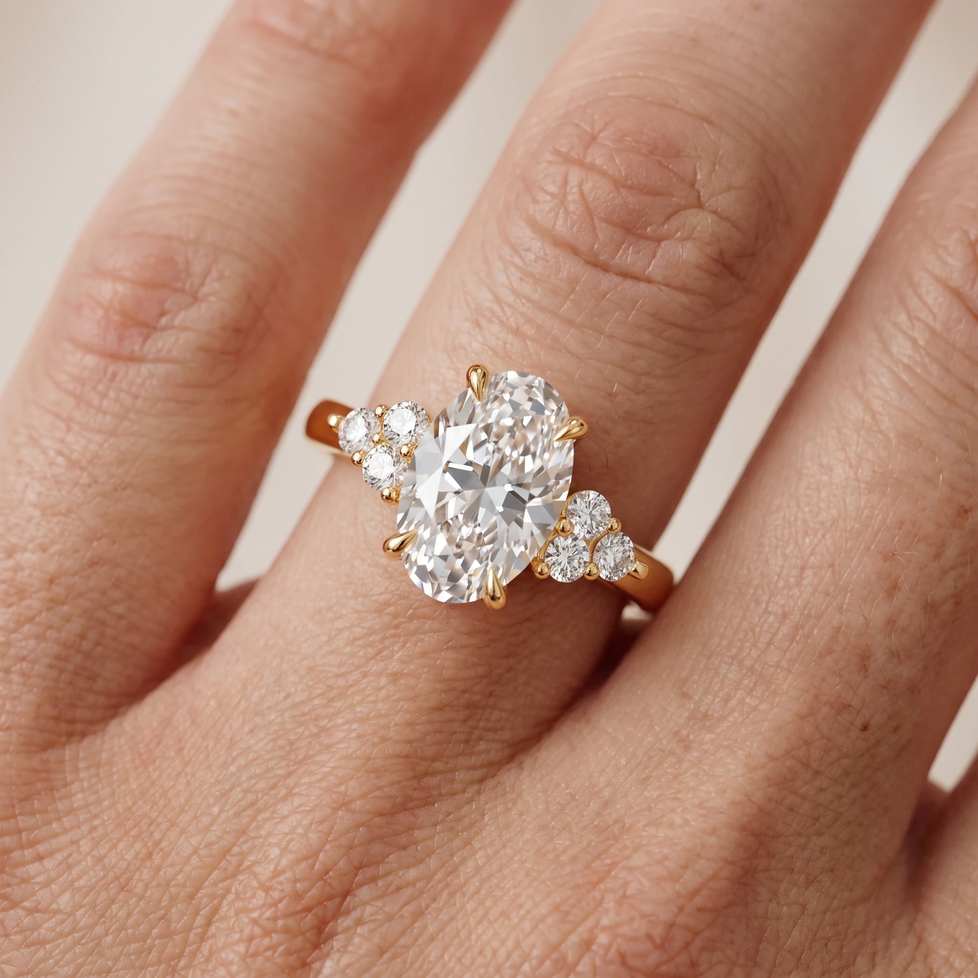 Anya Sidestone Cluster Oval Diamond Ring in Yellow Gold - lifestyle.jpg