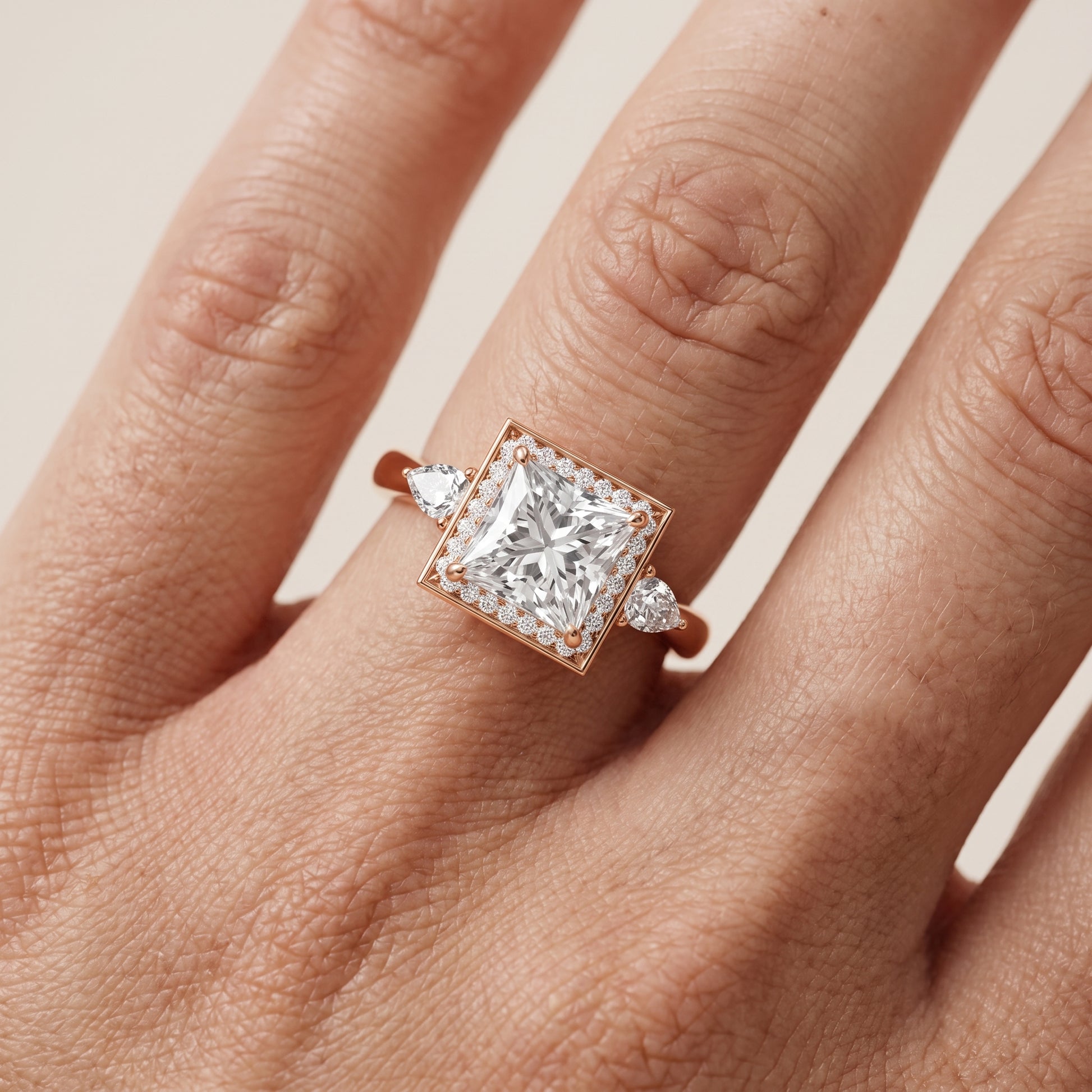 Eliza Halo Sidestone Princess Diamond Engagement Ring in Rose Gold - lifestyle.jpg