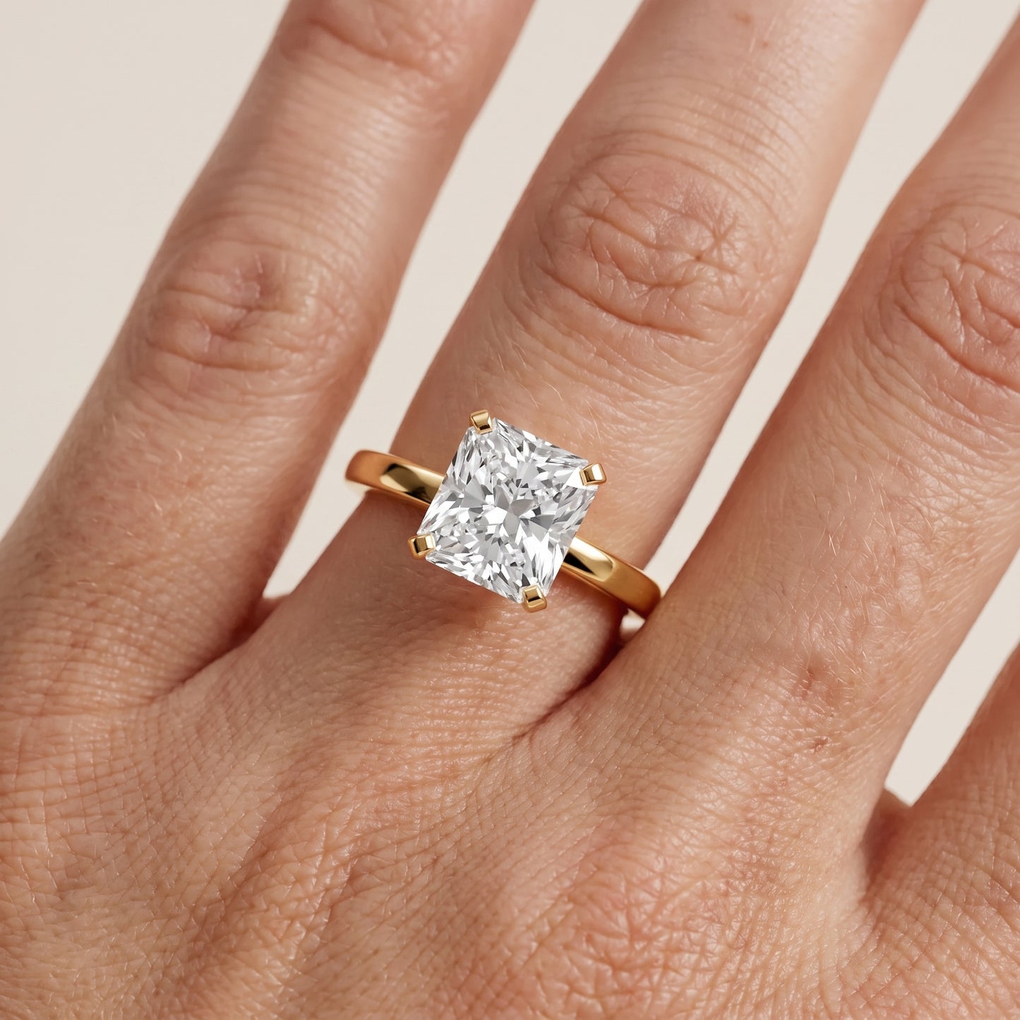 Liana Solitaire Claw Prong Radiant Diamond Engagement Ring in Yellow Gold - lifestyle.jpg
