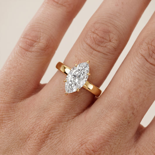Lara Hidden Halo Marquise Diamond Engagement Ring in Yellow Gold - lifestyle.jpg