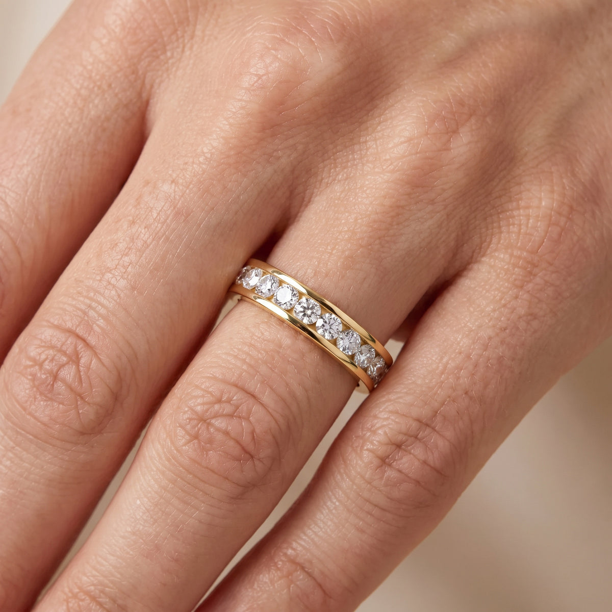 Catherine Channel Set Round Diamond Eternity Band in Yellow Gold - lifestyle.jpg
