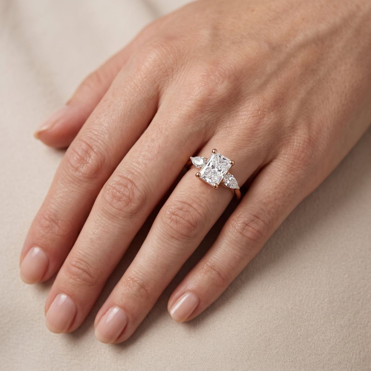 Faye Three-Stone Trellis Radiant Diamond Engagement Ring in Rose Gold - lifestyle.jpg