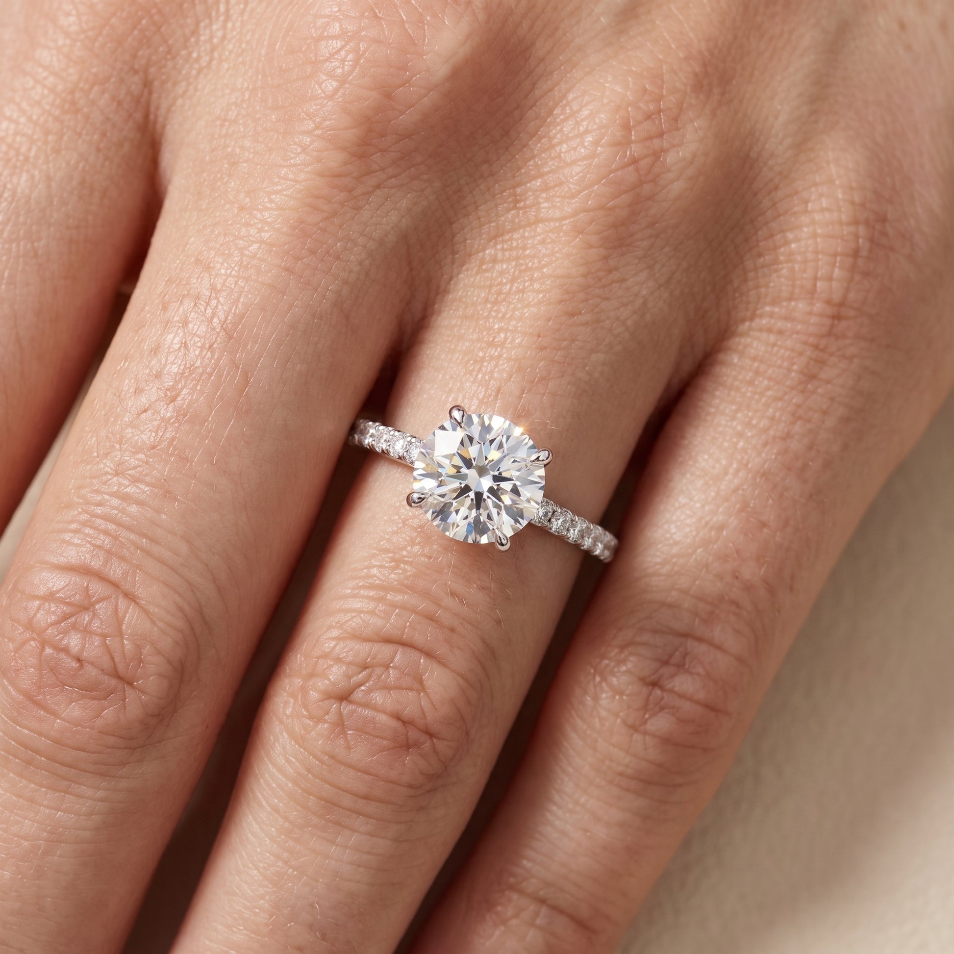 Ione Solitaire Pavé Round Diamond Engagement Ring in Platinum - lifestyle.jpg