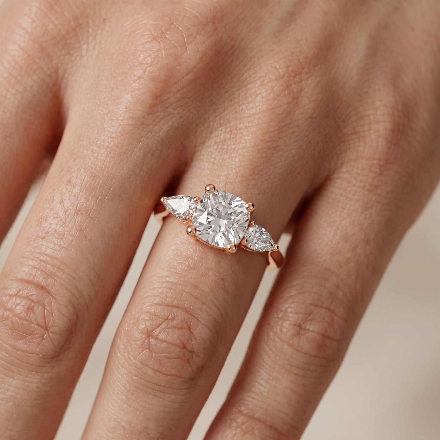 Faye Three-Stone Trellis Cushion Diamond Ring in Rose Gold - lifestyle.jpg