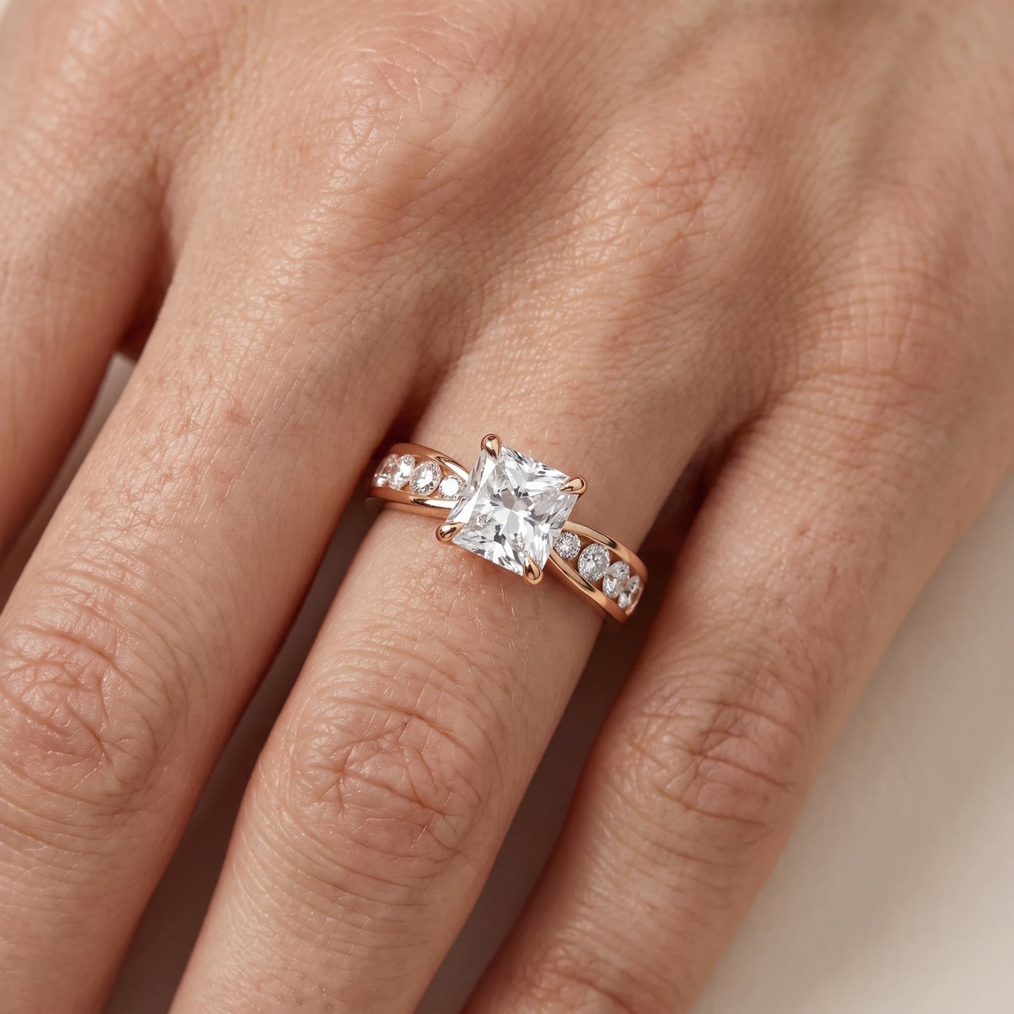 Noor Channel Set Sidestone Radiant Diamond Engagement Ring in Rose Gold - lifestyle.jpg