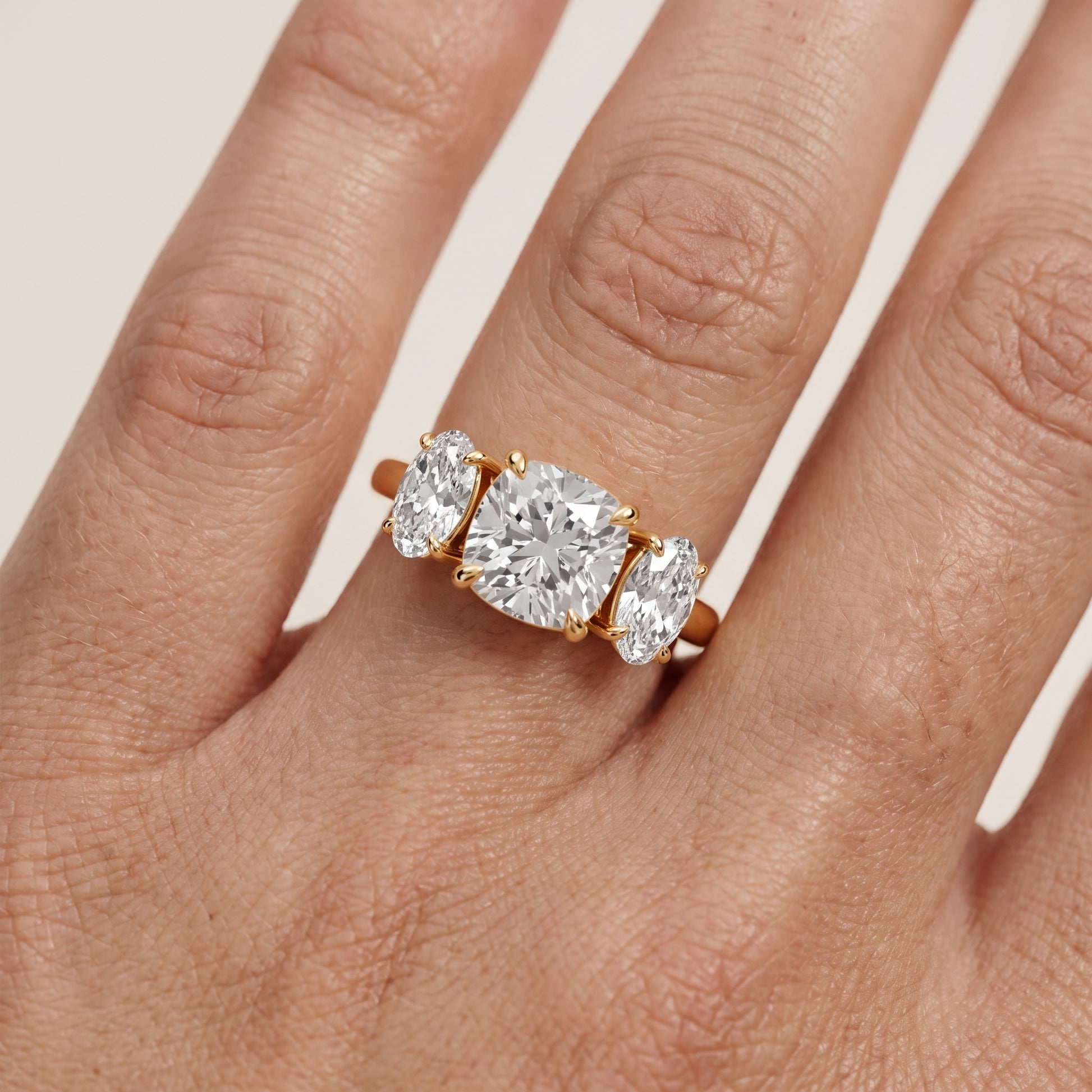Lila Three-Stone Cushion Diamond Ring in Yellow Gold - lifestyle.jpg