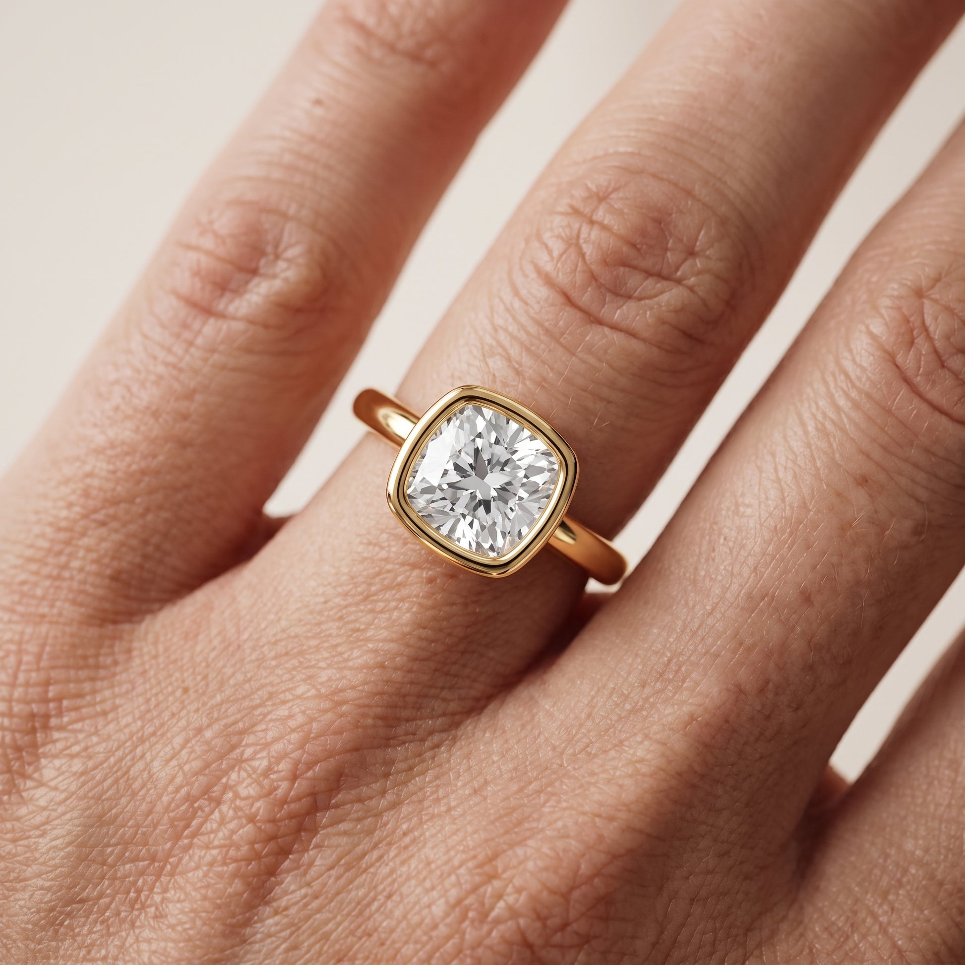 Maeve Bezel Solitaire Cushion Diamond Ring in Yellow Gold - lifestyle.jpg