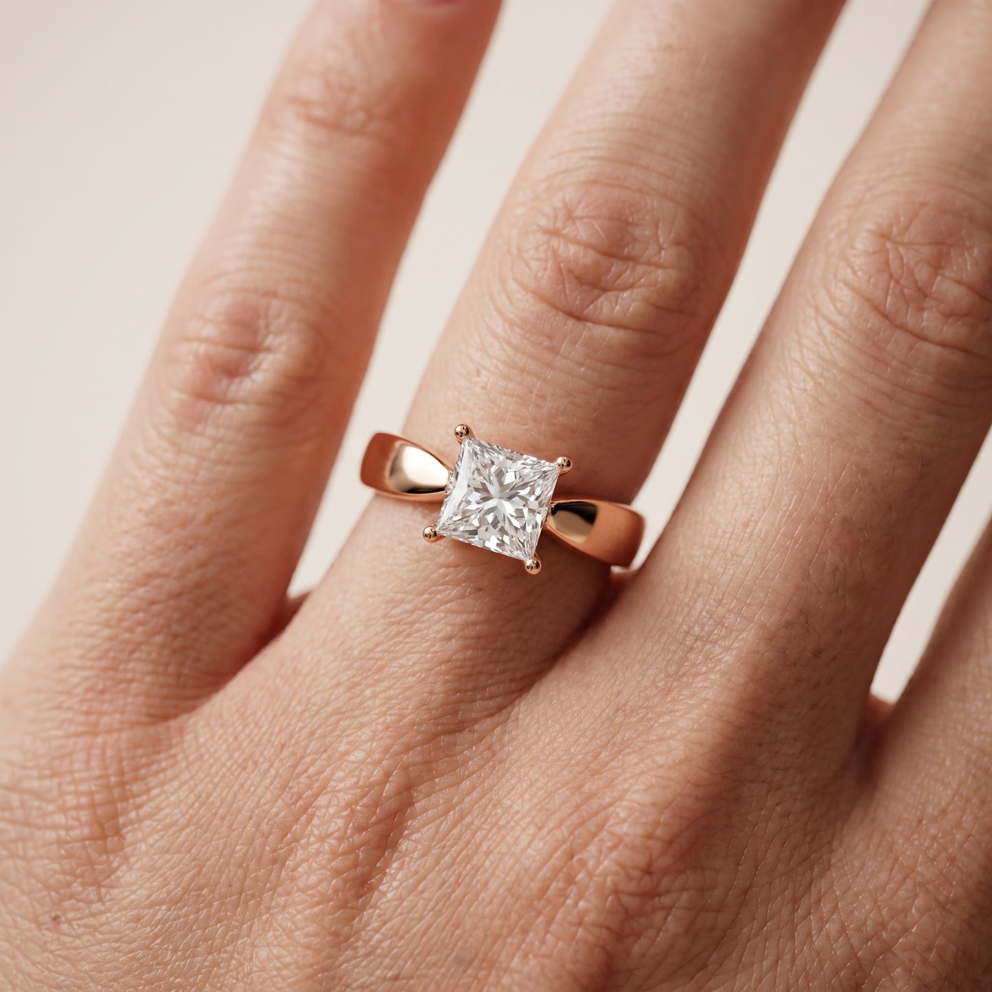 Talia Solitaire Twist Princess Diamond Engagement Ring in Rose Gold - lifestyle.jpg