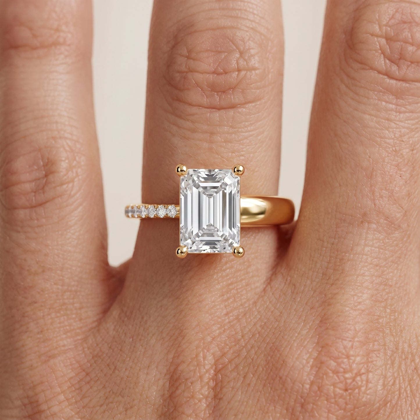 Rosie Solitaire Basket Emerald Diamond Engagement Ring in Yellow Gold - lifestyle.jpg