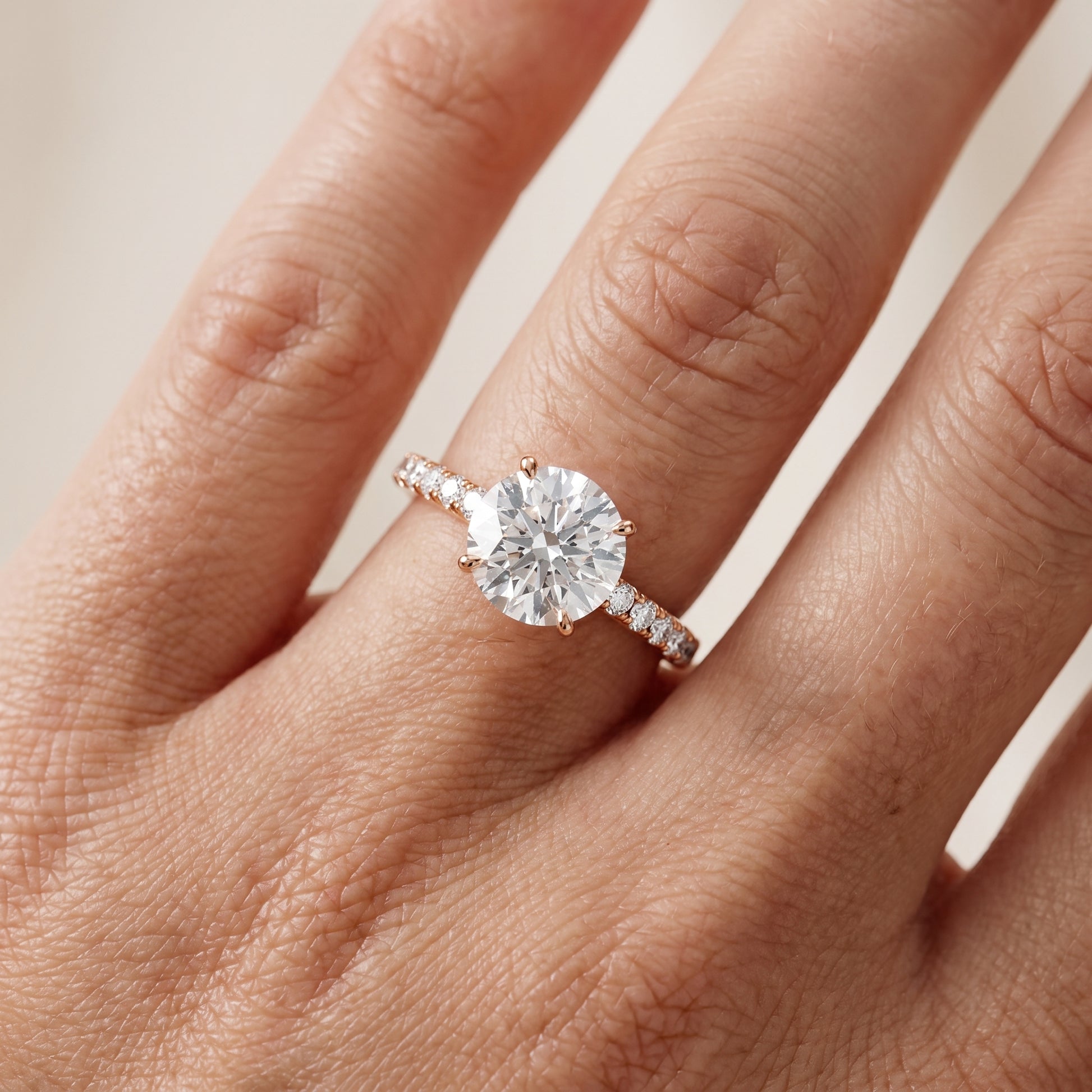 Juna French Pavé Solitaire Round Diamond Engagement Ring in Rose Gold - lifestyle.jpg