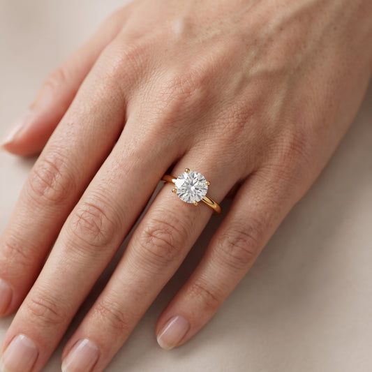 Maisie Four Prong Solitaire Round Diamond Engagement Ring in Yellow Gold - lifestyle.jpg