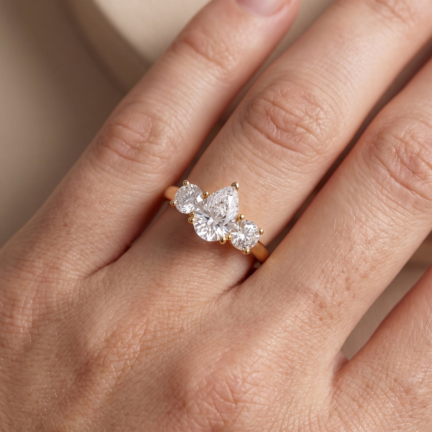 Callie Three-Stone Trellis Pear Diamond Engagement Ring in Yellow Gold - lifestyle.jpg