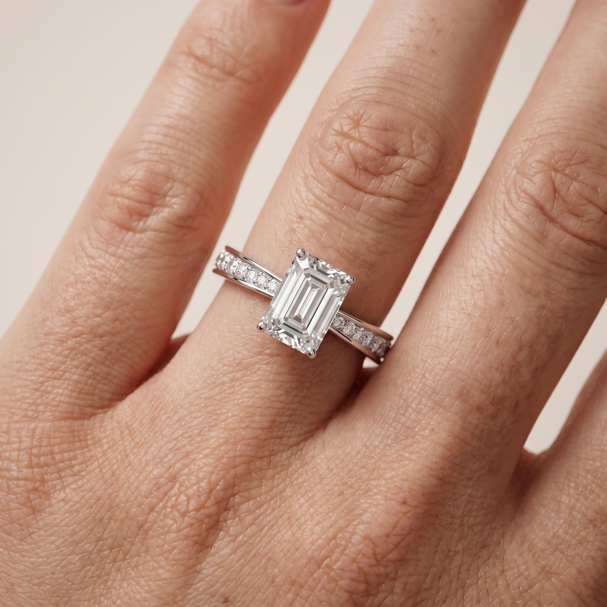 Rhea Sidestone Pavé Emerald Diamond Engagement Ring in Silver - lifestyle.jpg