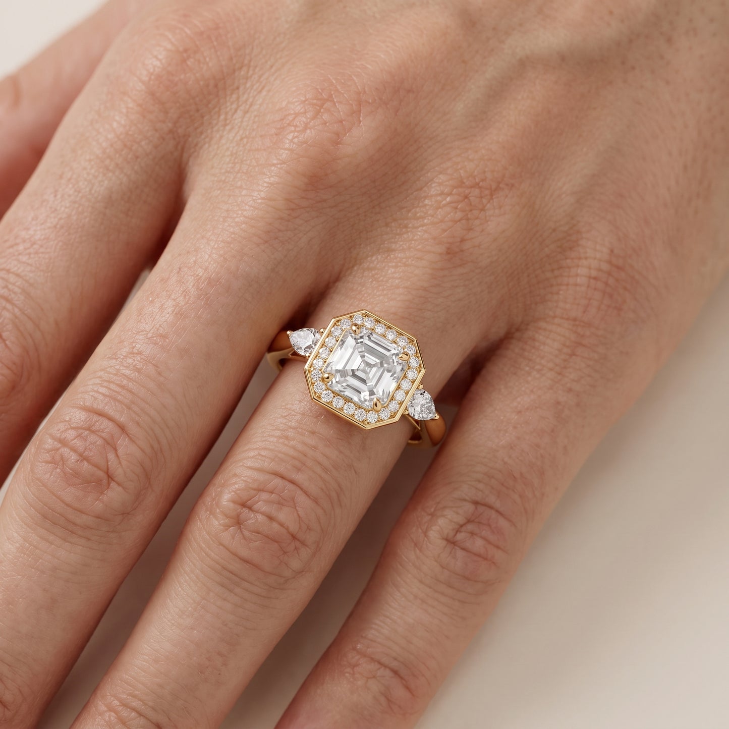 Eliza Halo Sidestone Asscher Diamond Engagement Ring in Yellow Gold - lifestyle.jpg