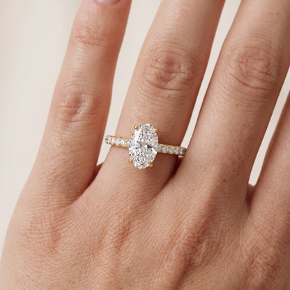 Thea Hidden Halo Pavé Oval Diamond Engagement Ring in Yellow Gold - lifestyle.jpg