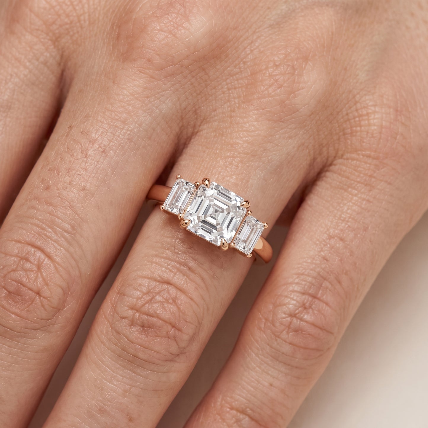 Zoe Three-Stone Asscher Diamond Ring in Rose Gold - lifestyle.jpg