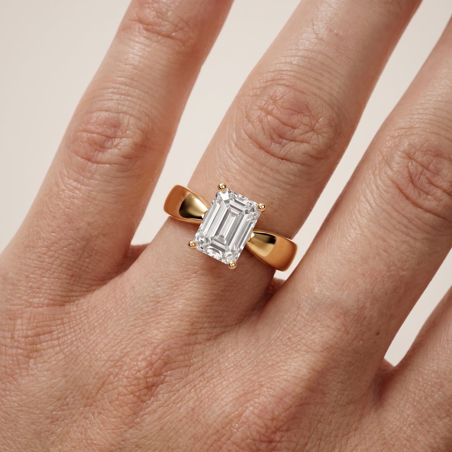 Talia Solitaire Twist Emerald Diamond Engagement Ring in Yellow Gold - lifestyle.jpg