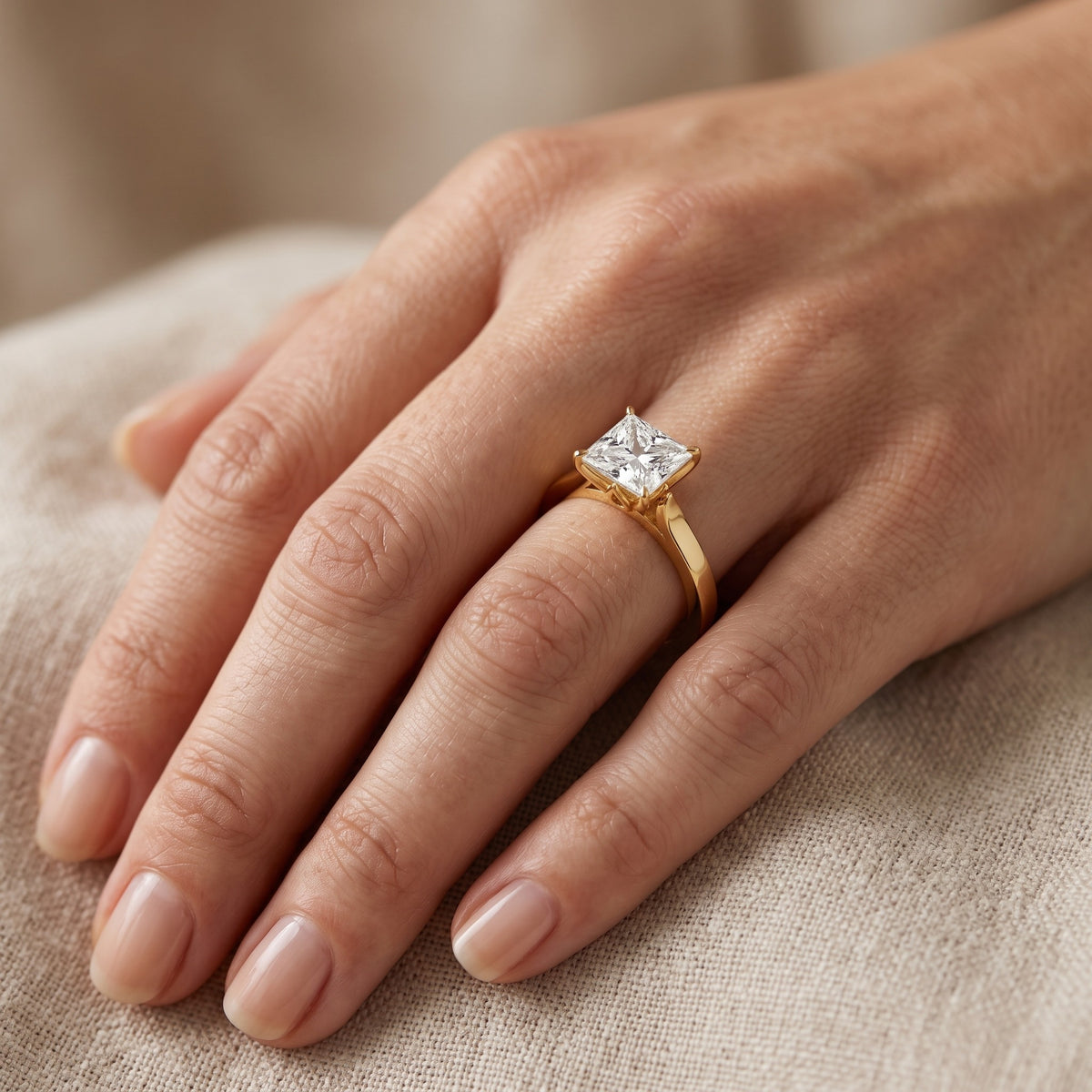 Isabella Bloom Solitaire Princess Diamond Engagement Ring in Yellow Gold - lifestyle.jpg