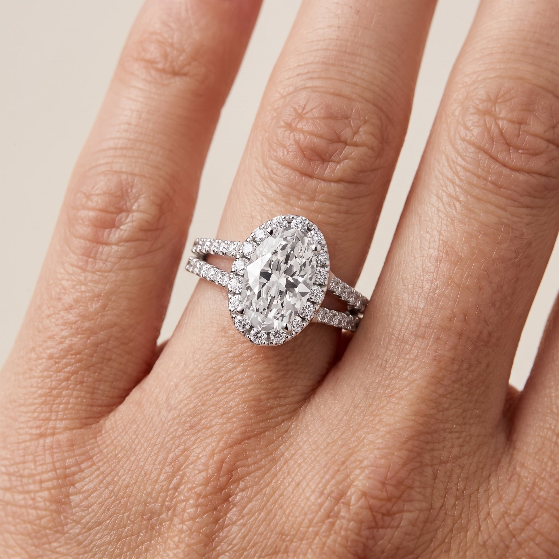 Kira Halo Split Shank Oval Diamond Engagement Ring in Silver - lifestyle.jpg