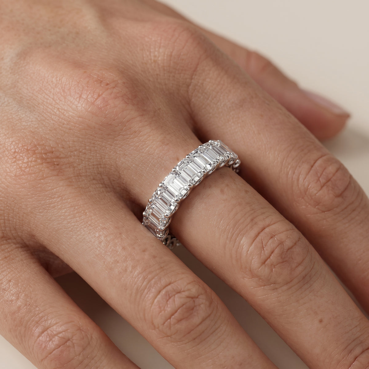 Florence Shared Prong Emerald Diamond Eternity Band in Silver - lifestyle.jpg