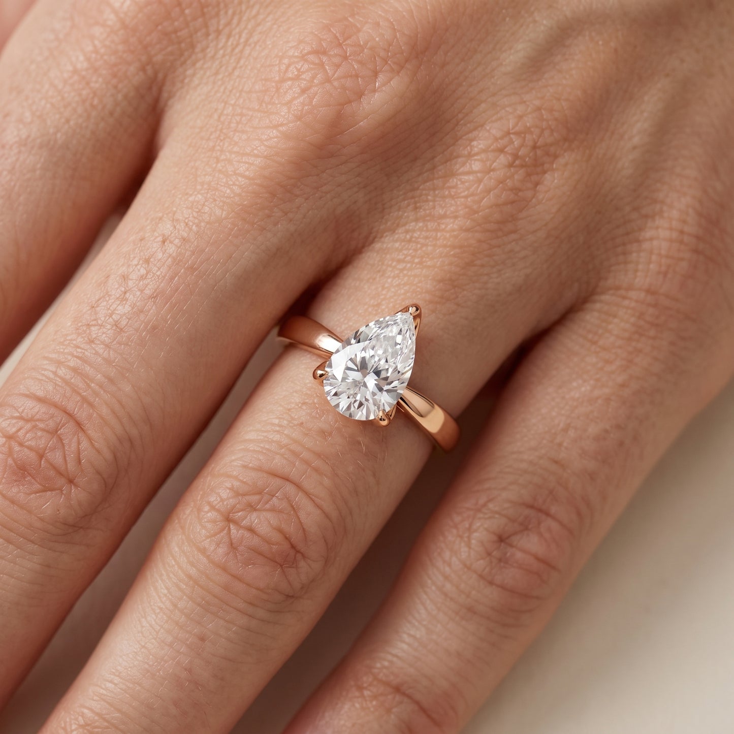 Lucia Solitaire Six-Prong Pear Diamond Engagement Ring in Rose Gold - lifestyle.jpg