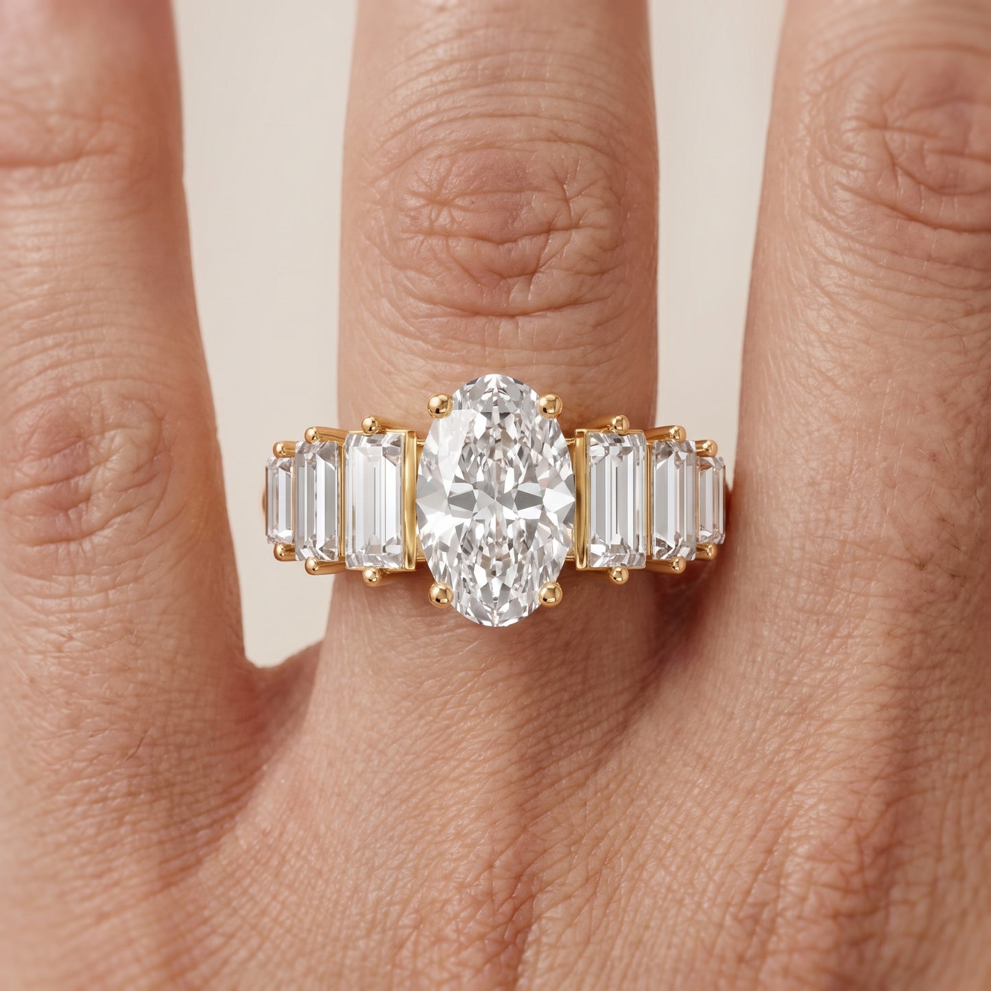 Mara Sidestone Baguette Accent Oval Diamond Engagement Ring in Yellow Gold - lifestyle.jpg