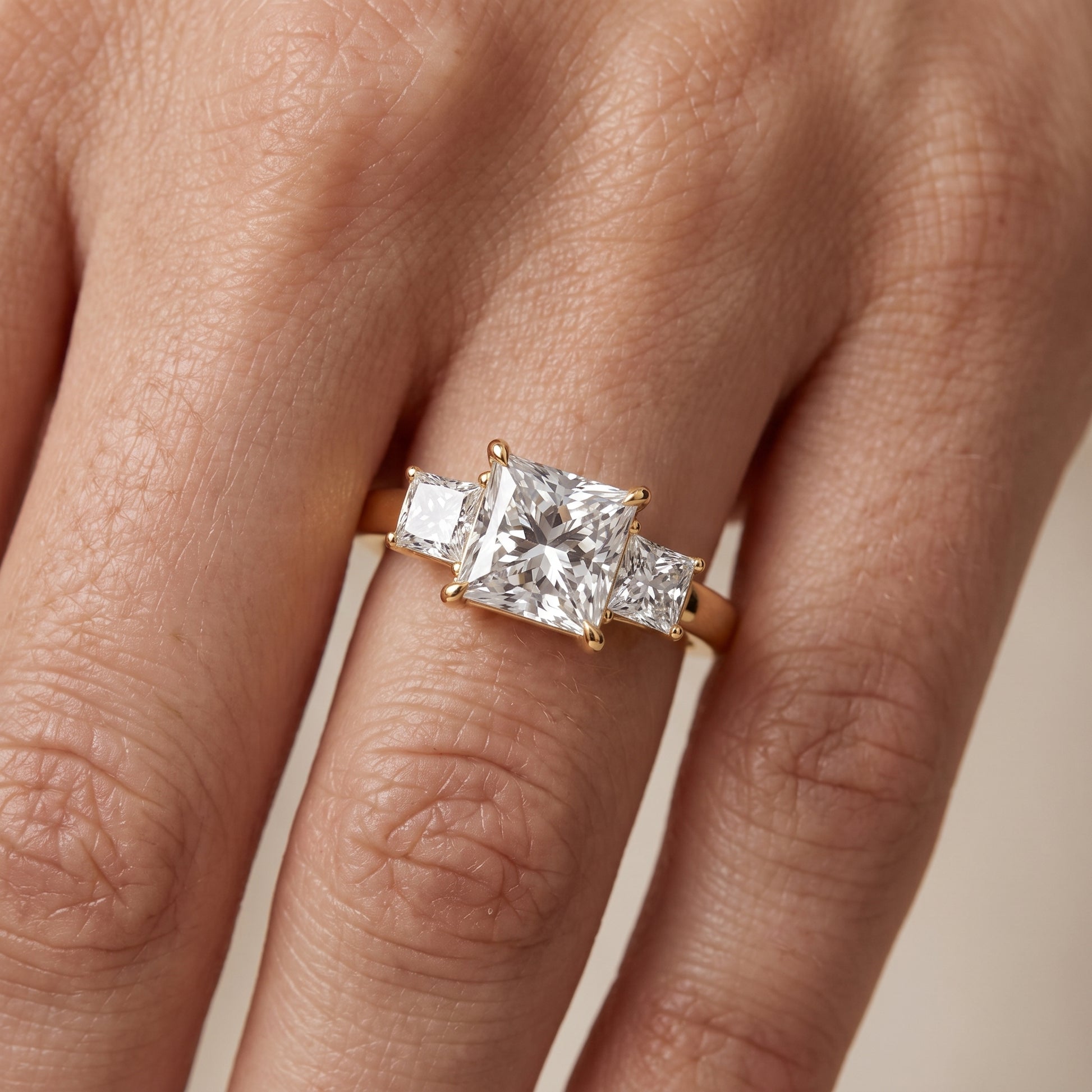 Selena Three-Stone Basket Princess Diamond Ring in Yellow Gold - lifestyle.jpg