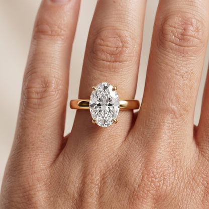 Lara Hidden Halo Oval Diamond Engagement Ring in Yellow Gold - lifestyle.jpg