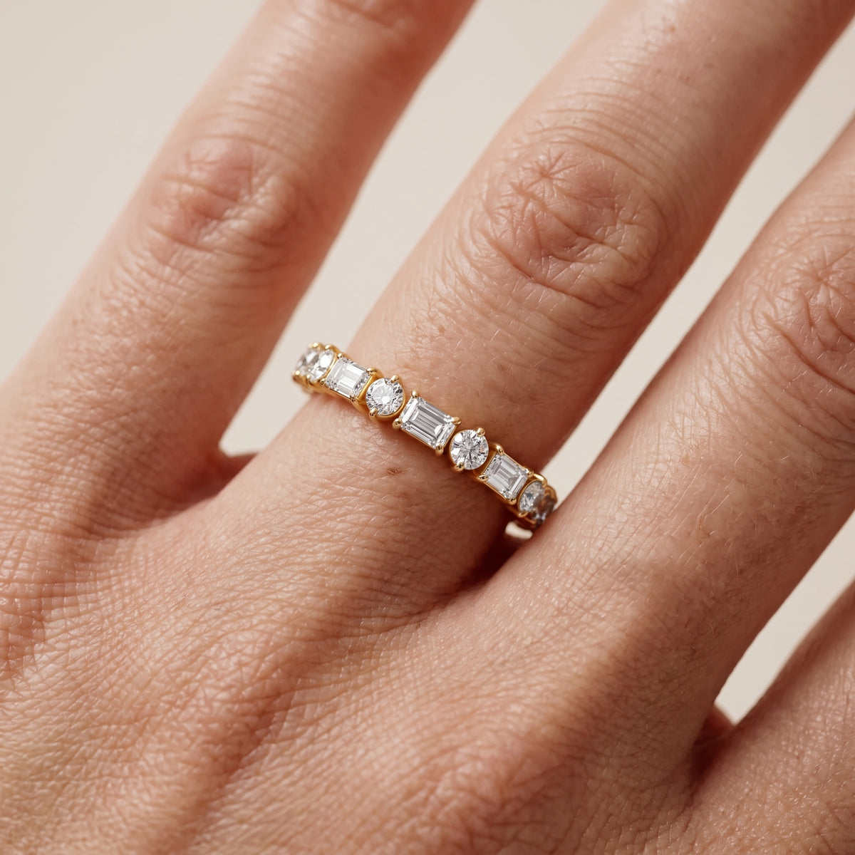 Rebecca Four Prong Emerald & Round Diamond Half Eternity Band in Yellow Gold - lifestyle.jpg