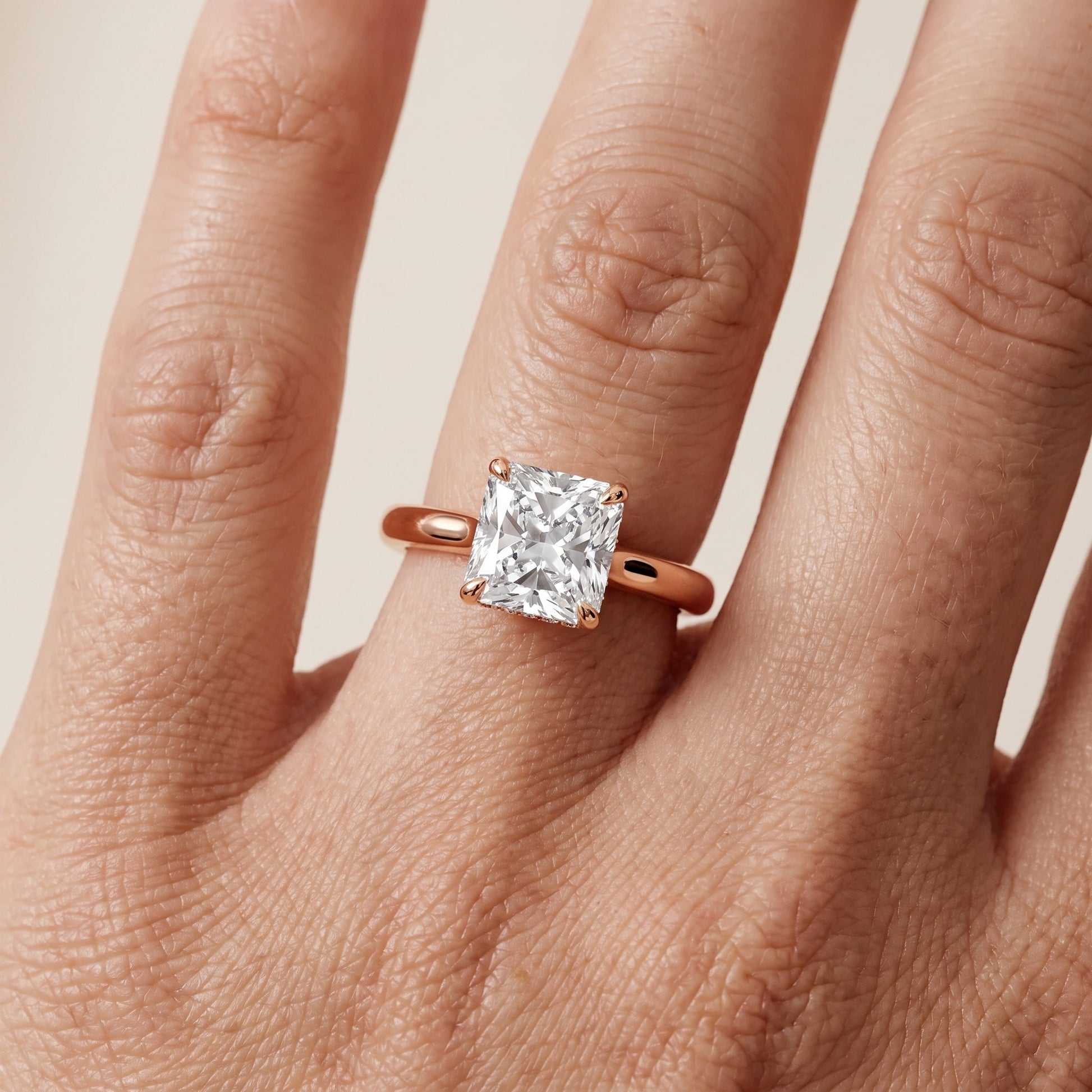 Mena Hidden Halo Radiant Diamond Engagement Ring in Rose Gold - lifestyle.jpg