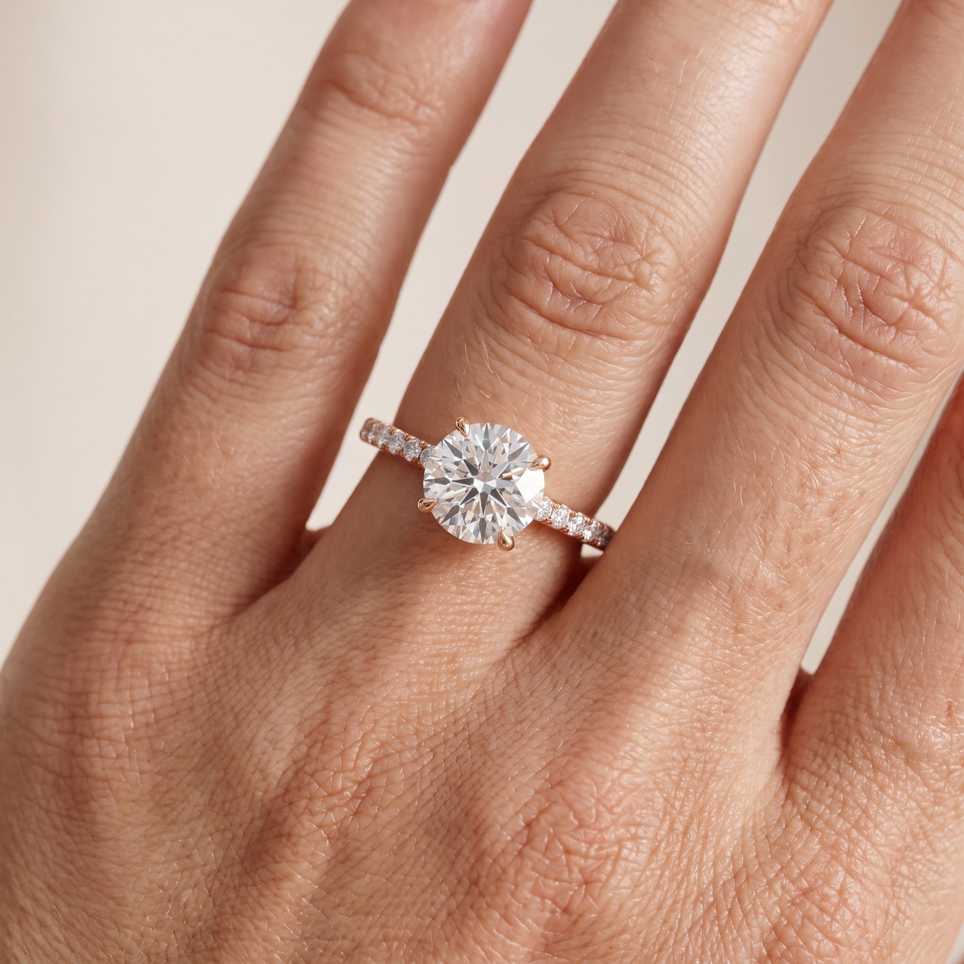 Ione Solitaire Pavé Round Diamond Engagement Ring in Rose Gold - lifestyle.jpg