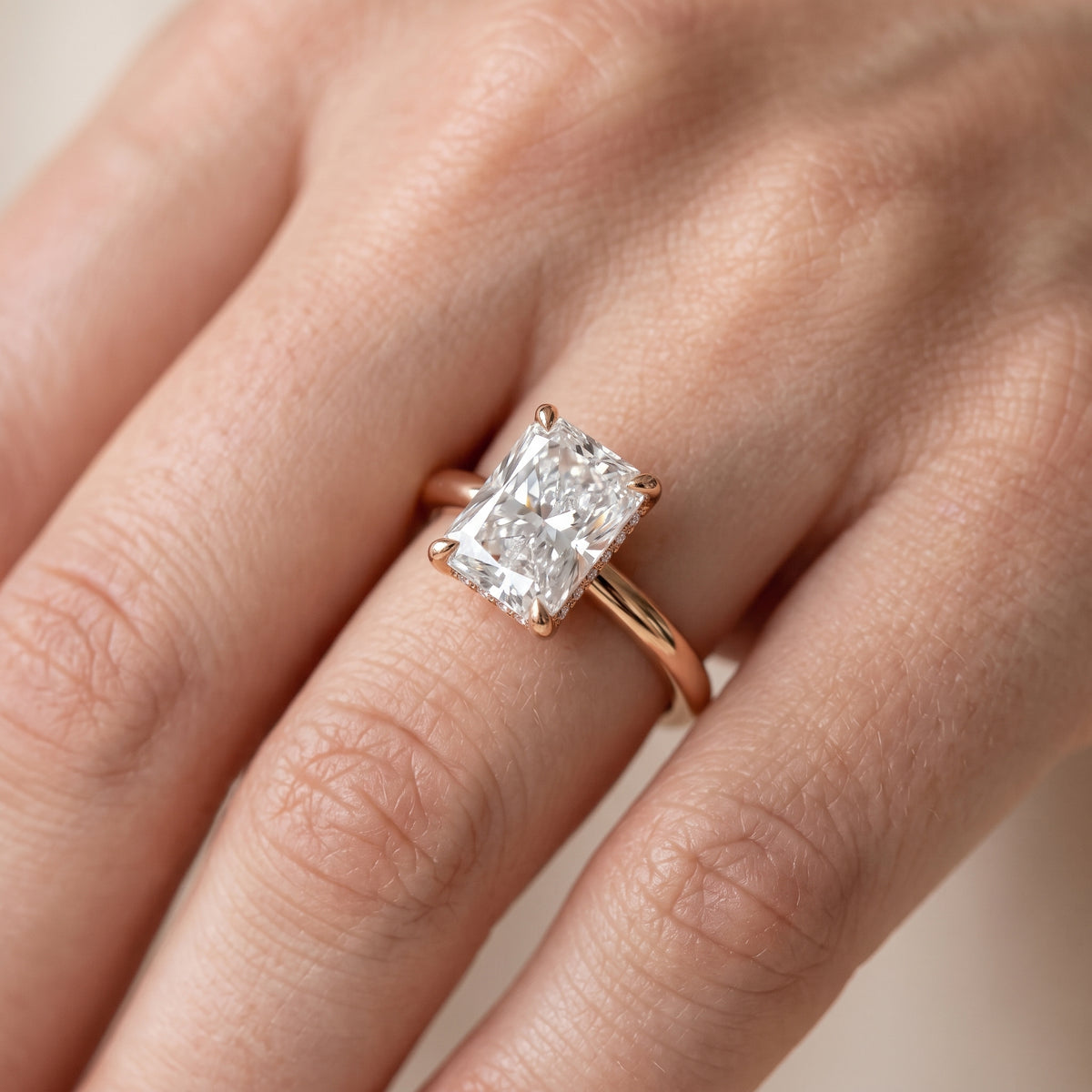Amaya Hidden Halo Radiant Diamond Engagement Ring in Rose Gold - lifestyle.jpg