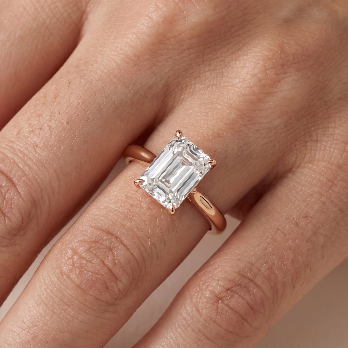 Evie Solitaire Six-Prong Emerald Diamond Engagement Ring in Rose Gold - lifestyle.jpg
