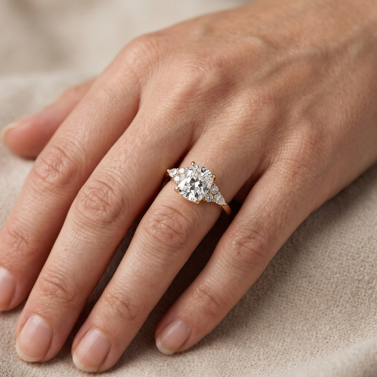 Amelia Three Stone Cushion Diamond Engagement Ring in Yellow Gold - lifestyle.jpg