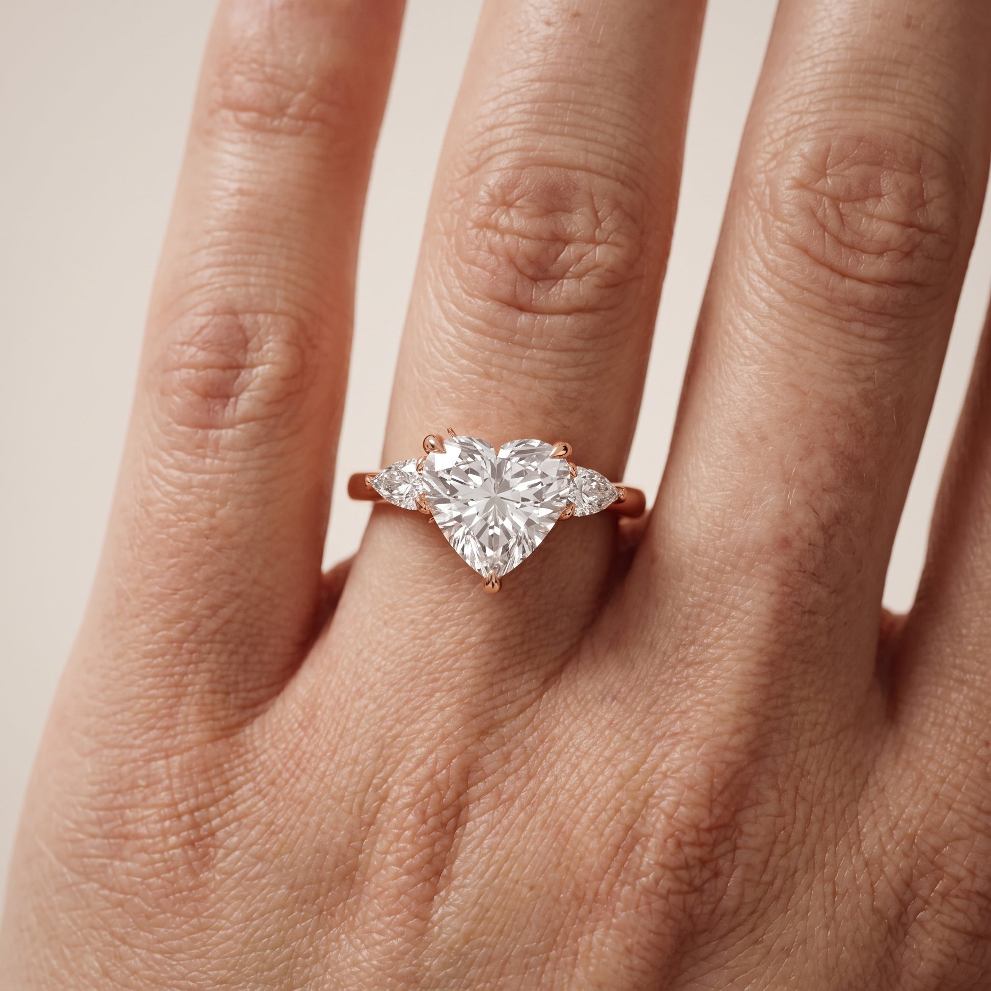 Leila Three-Stone Heart Diamond Engagement Ring in Rose Gold - lifestyle.jpg