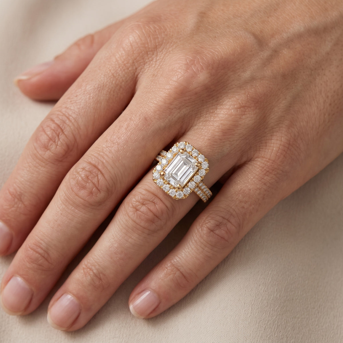 Blythe Halo Split Shank Emerald Diamond Engagement Ring in Yellow Gold - lifestyle.jpg