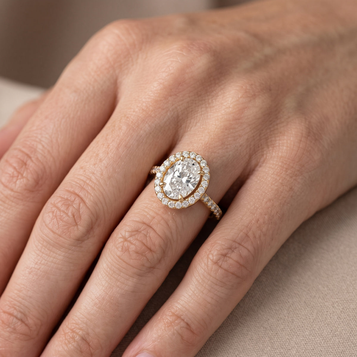 Anabel East-West Halo Oval Diamond Engagement Ring in Yellow Gold - lifestyle.jpg