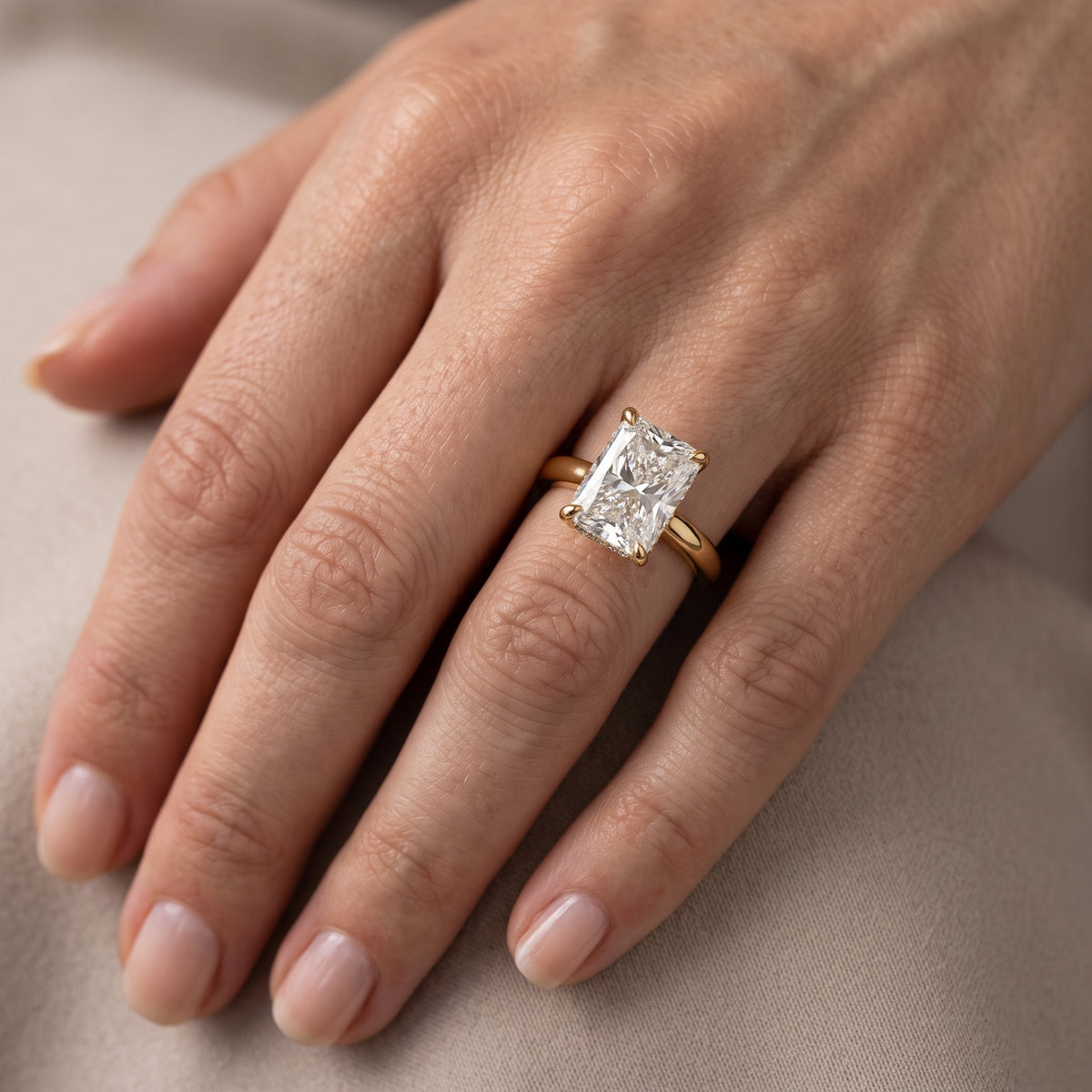 Mena Hidden Halo Radiant Diamond Engagement Ring in Yellow Gold - lifestyle.jpg