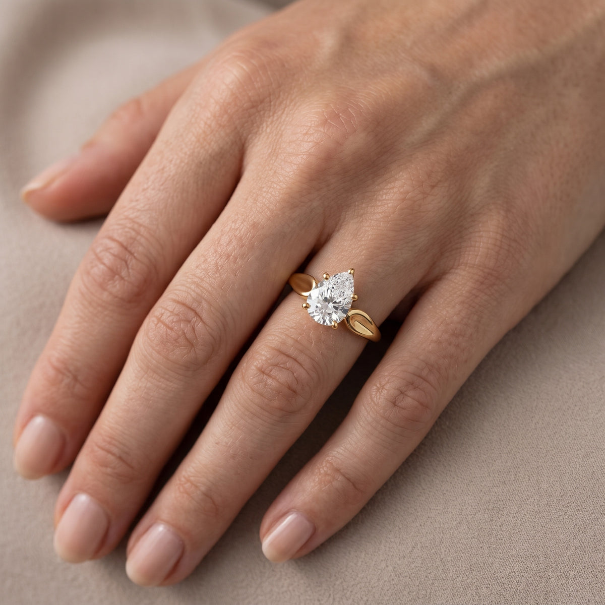 Lauretta Leaf Solitaire Pear Diamond Engagement Ring in Yellow Gold - lifestyle.jpg