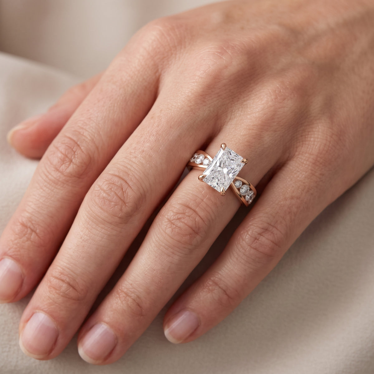 Rosalie Channel Set Sidestone Radiant Diamond Engagement Ring in Rose Gold - lifestyle.jpg