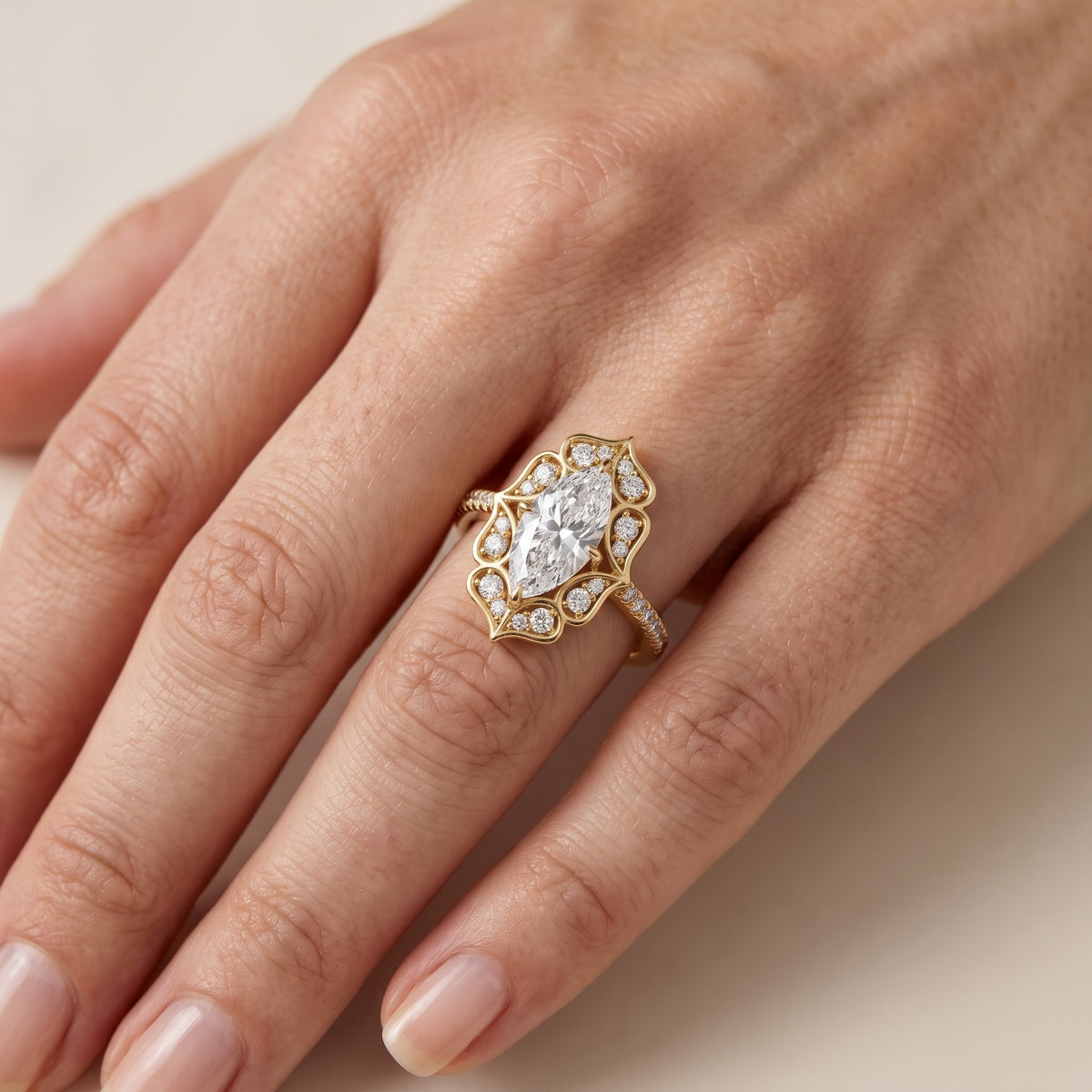 Caitlin Floral Halo Marquise Diamond Engagement Ring in Rose Gold - lifestyle.jpg