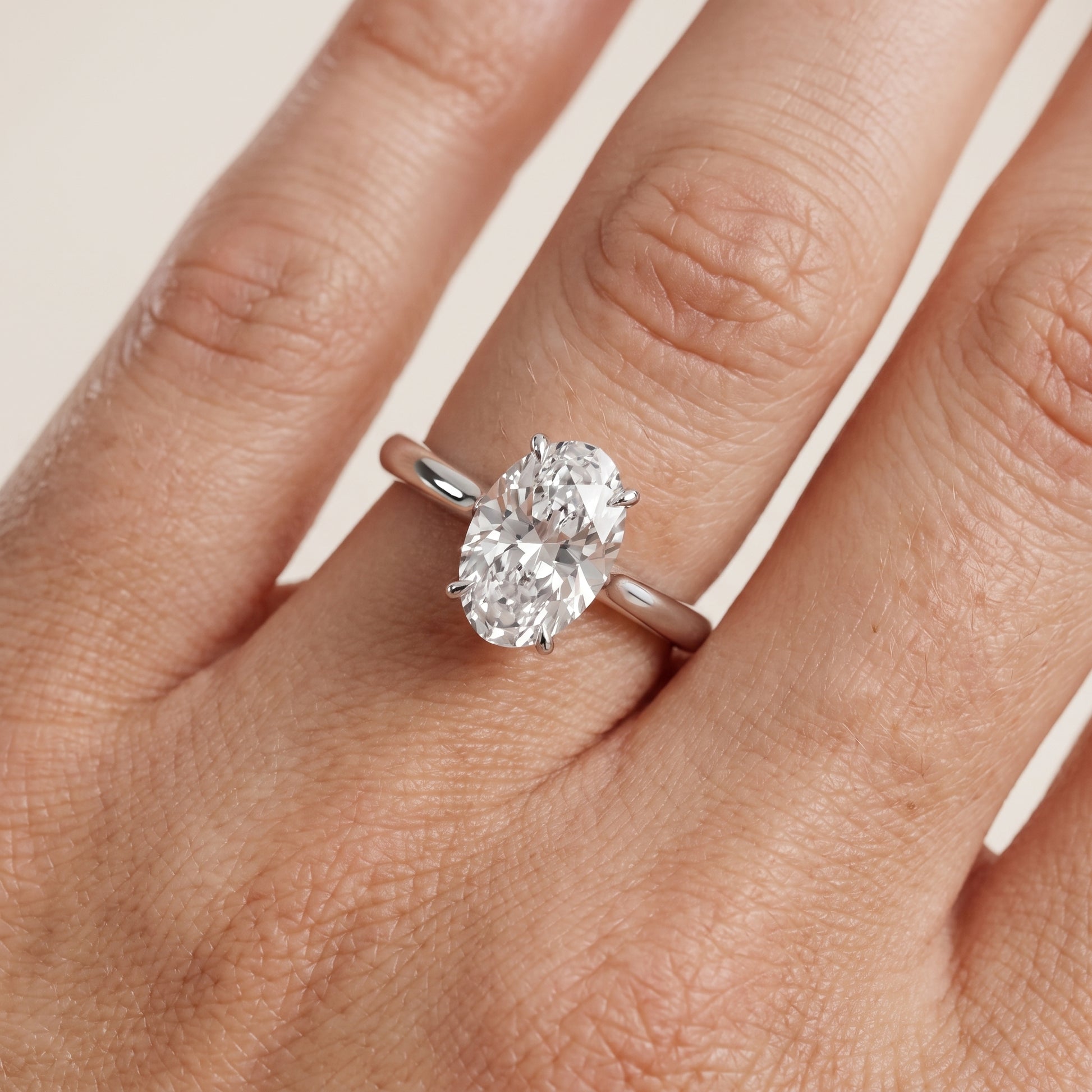 Evie Solitaire Six-Prong Oval Diamond Engagement Ring in Platinum - lifestyle.jpg