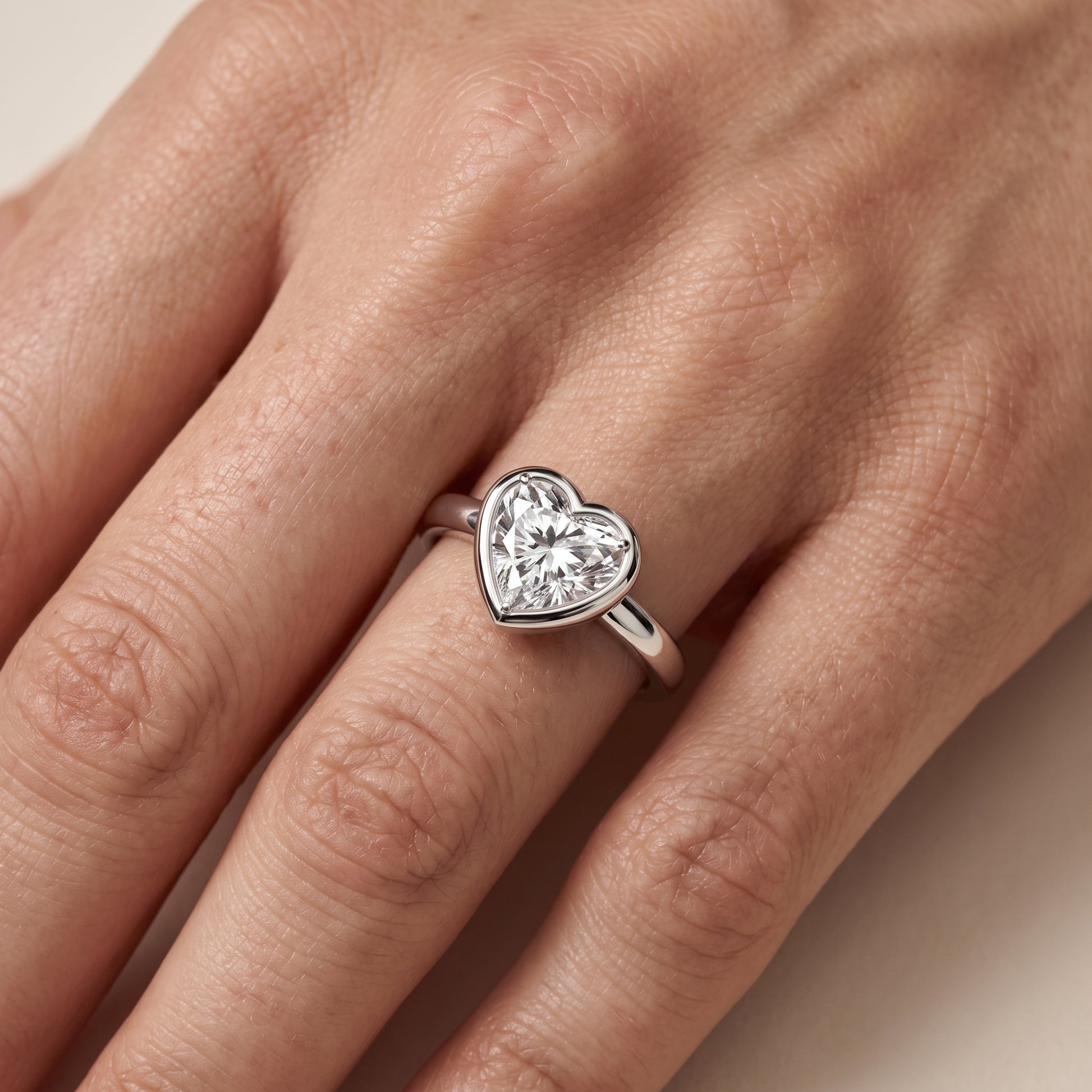 Alina Bezel Solitaire Heart Diamond Ring in Platinum - lifestyle.jpg