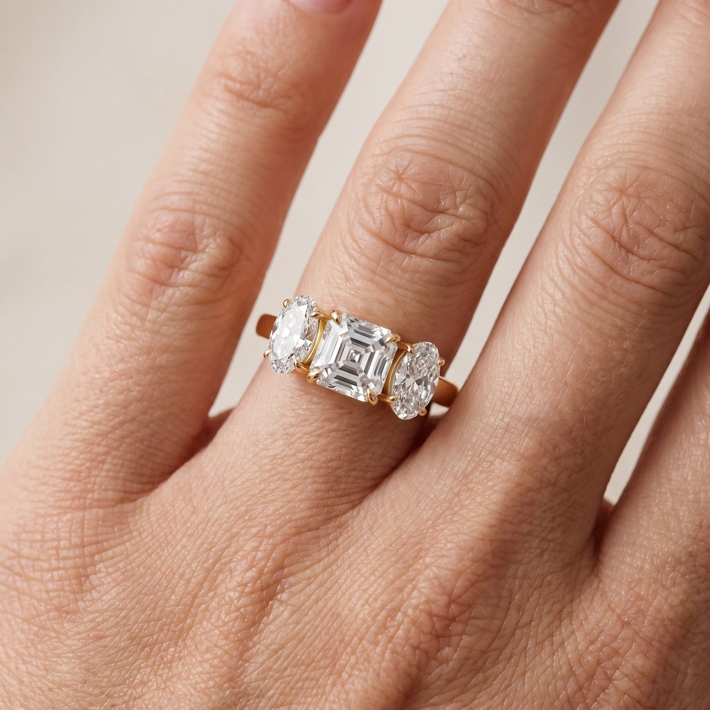 Lila Three-Stone Asscher Diamond Ring in Yellow Gold - lifestyle.jpg